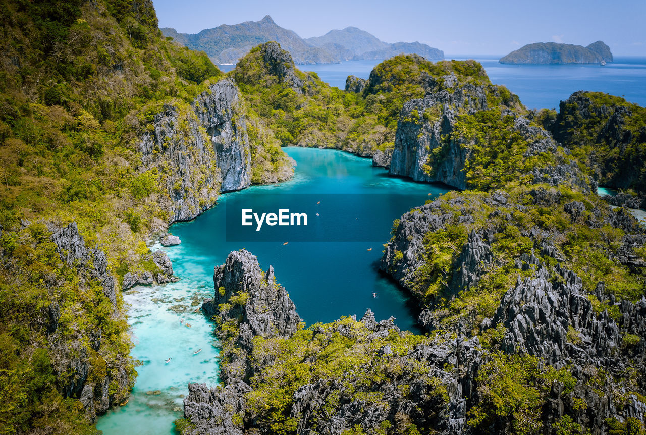 High angle view of trees by sea