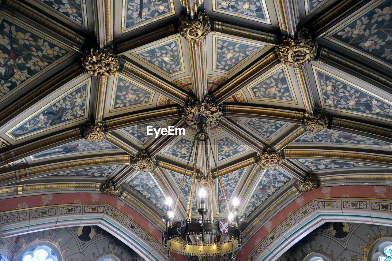 ceiling, architecture, built structure, indoors, pattern, low angle view, dome, no people, ornate, building, place of worship, architectural feature, travel destinations, arch, architecture and art, lighting equipment, religion, the past, belief, history, chandelier, decoration, shape, facade, mural, spirituality