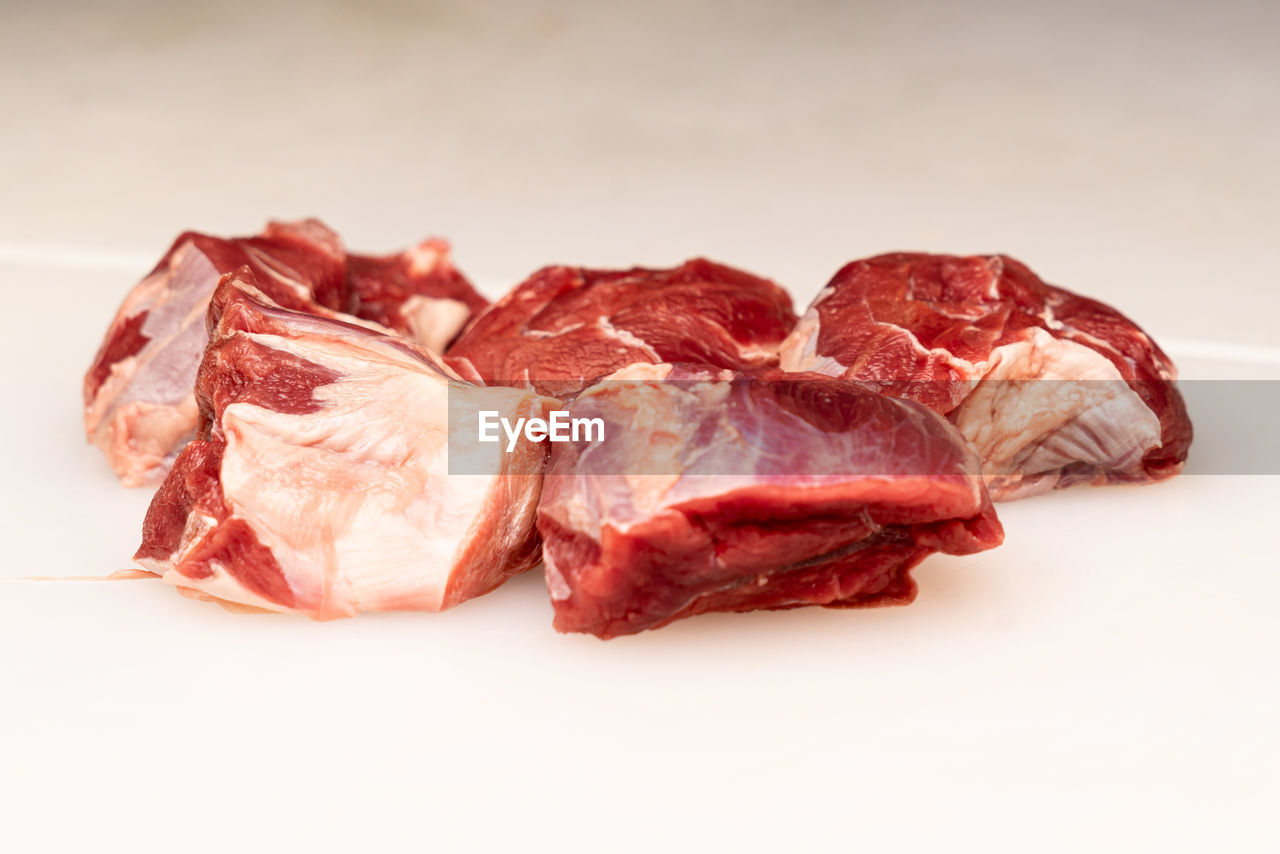 high angle view of meat on white background