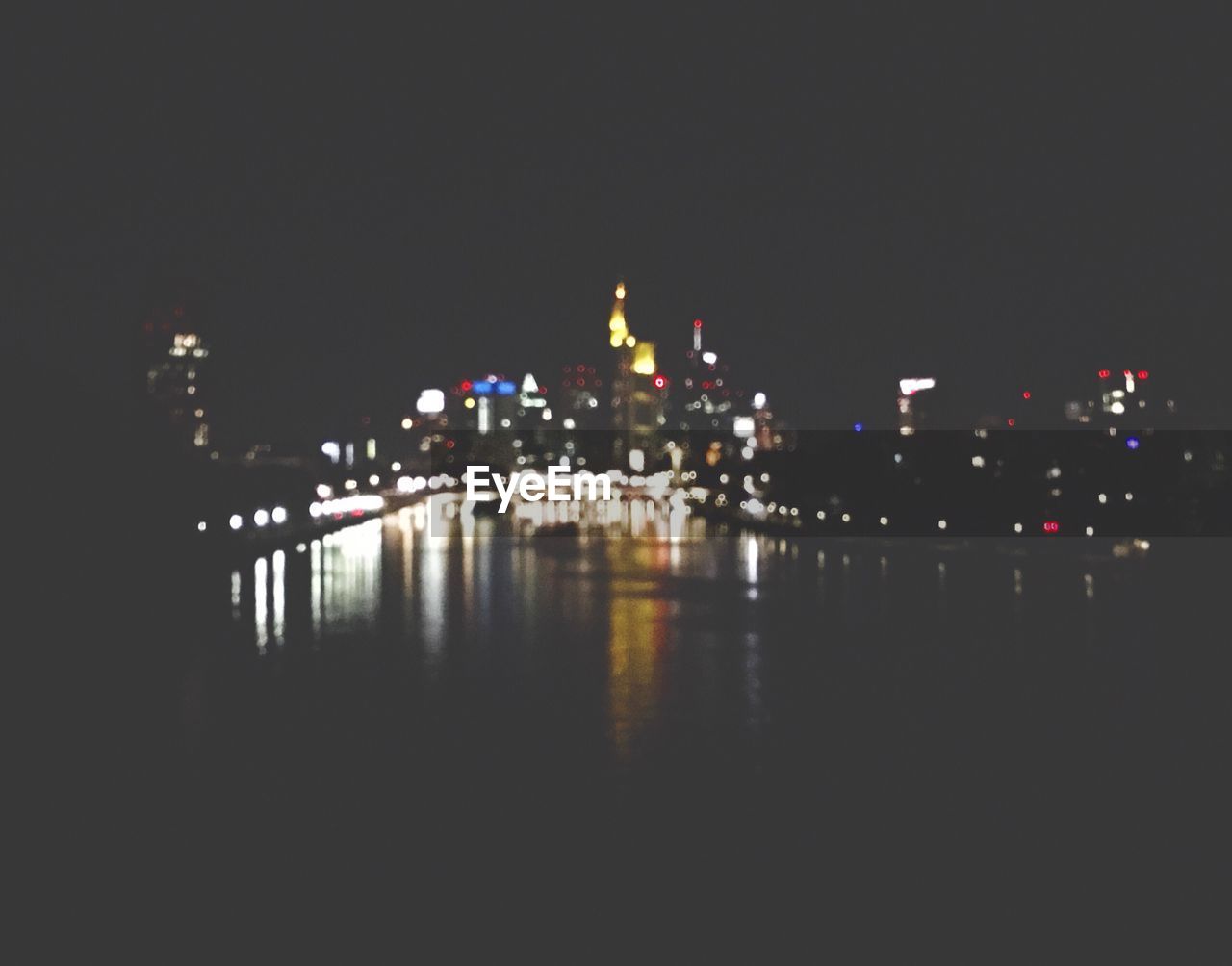 REFLECTION OF ILLUMINATED BUILDINGS IN WATER