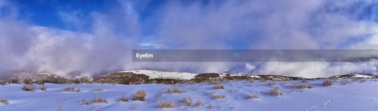 SCENIC VIEW OF SNOW COVERED MOUNTAINS AGAINST SKY