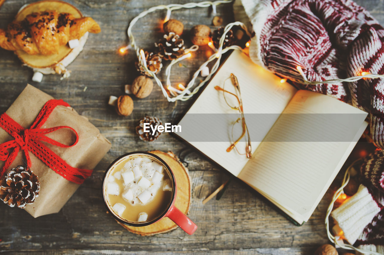 High angle view of hot chocolate with christmas decorations on table