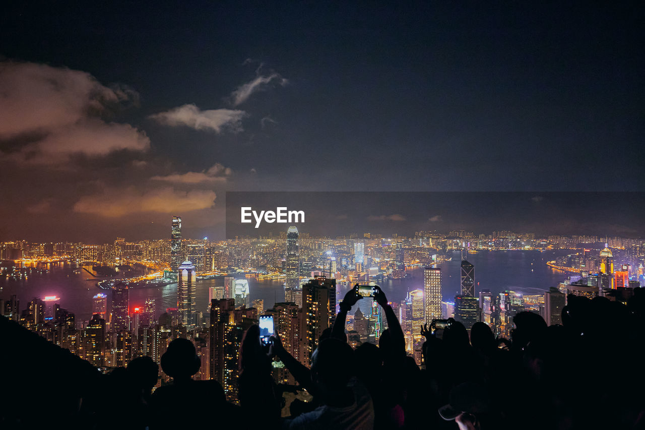 Panoramic view of illuminated buildings in city at night