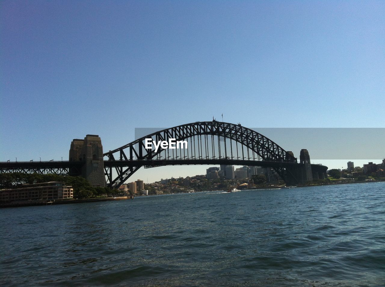 VIEW OF BRIDGE OVER RIVER IN CITY