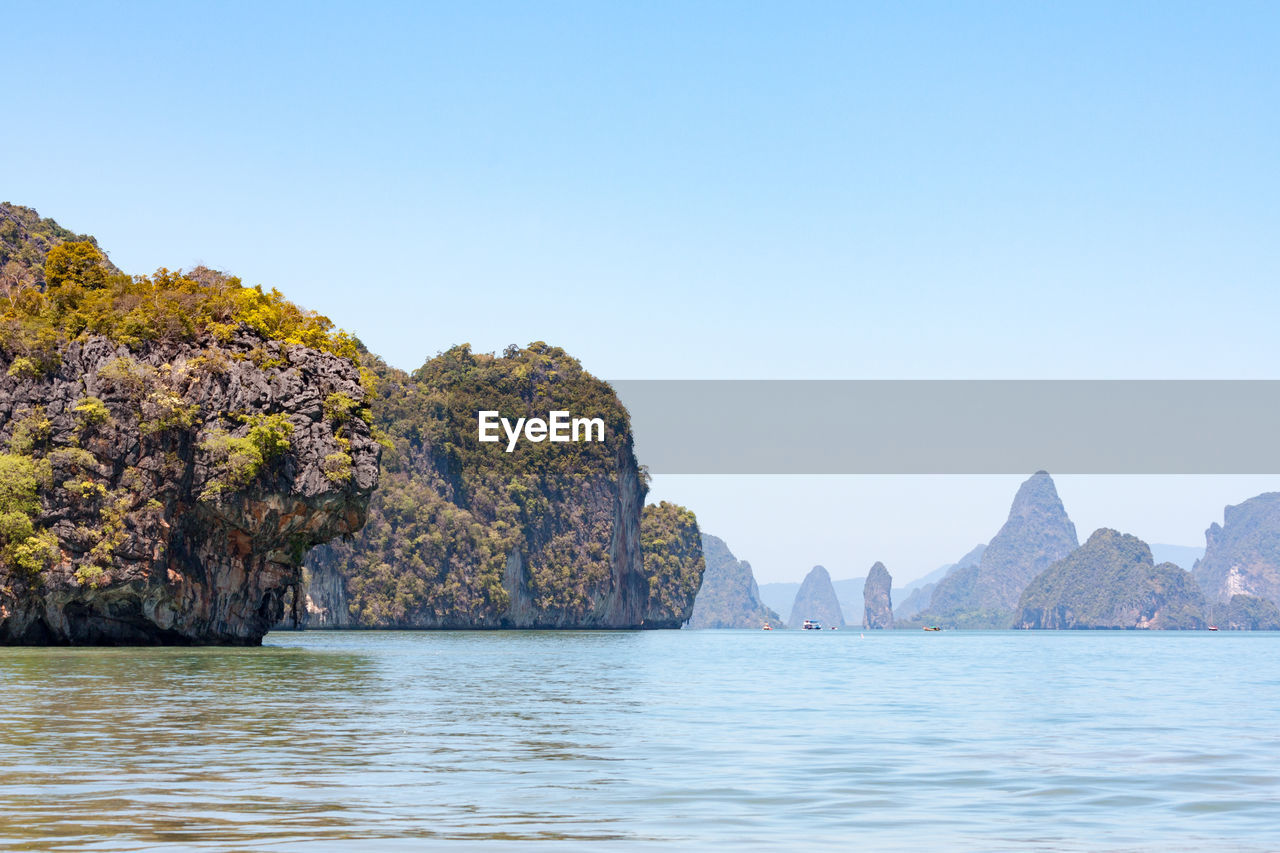 Scenic view of sea against clear blue sky