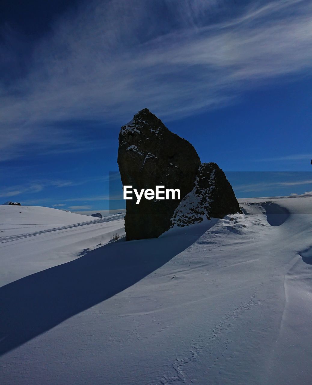 Scenic view of snowcapped mountain against sky