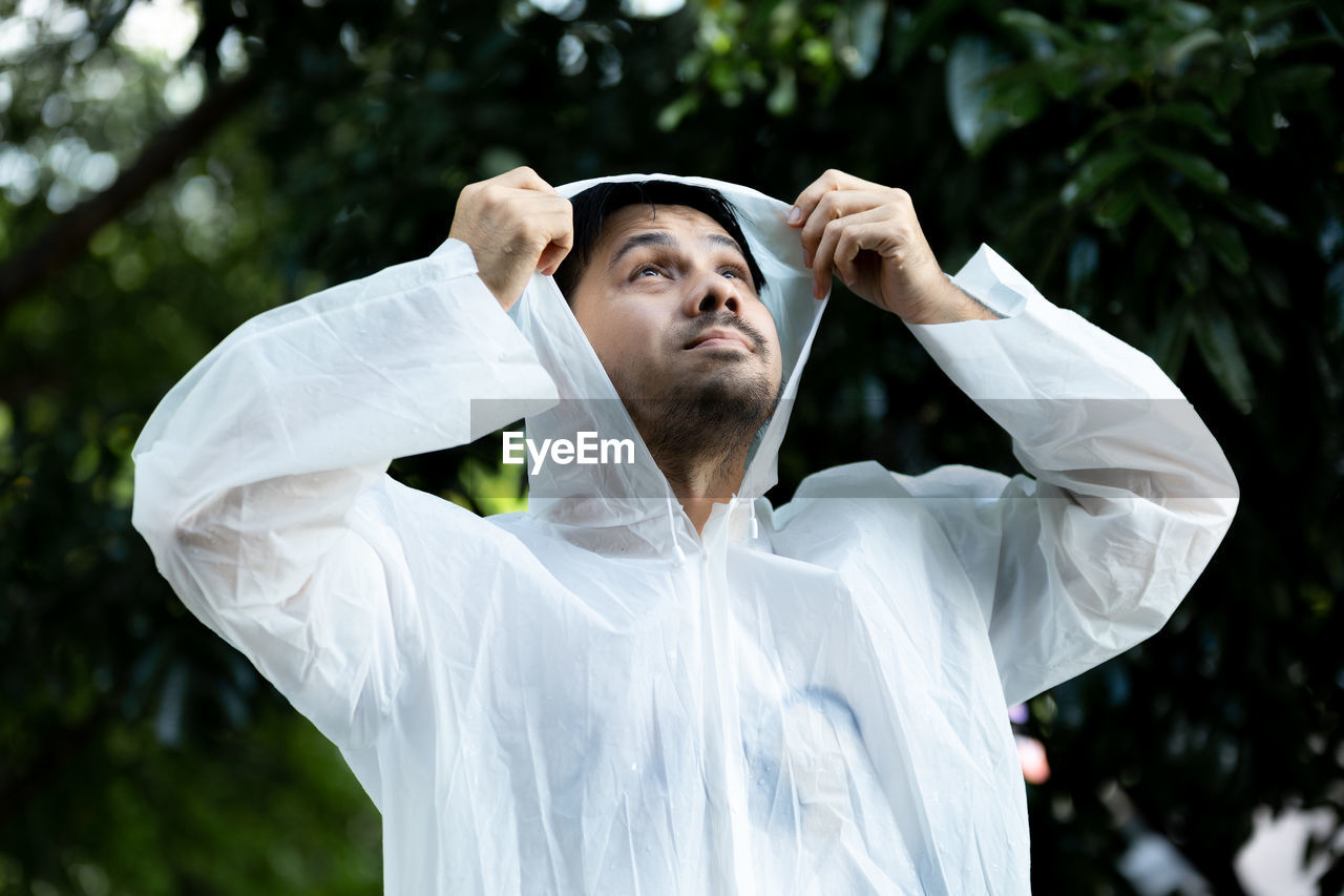 Portrait of young man standing outdoors