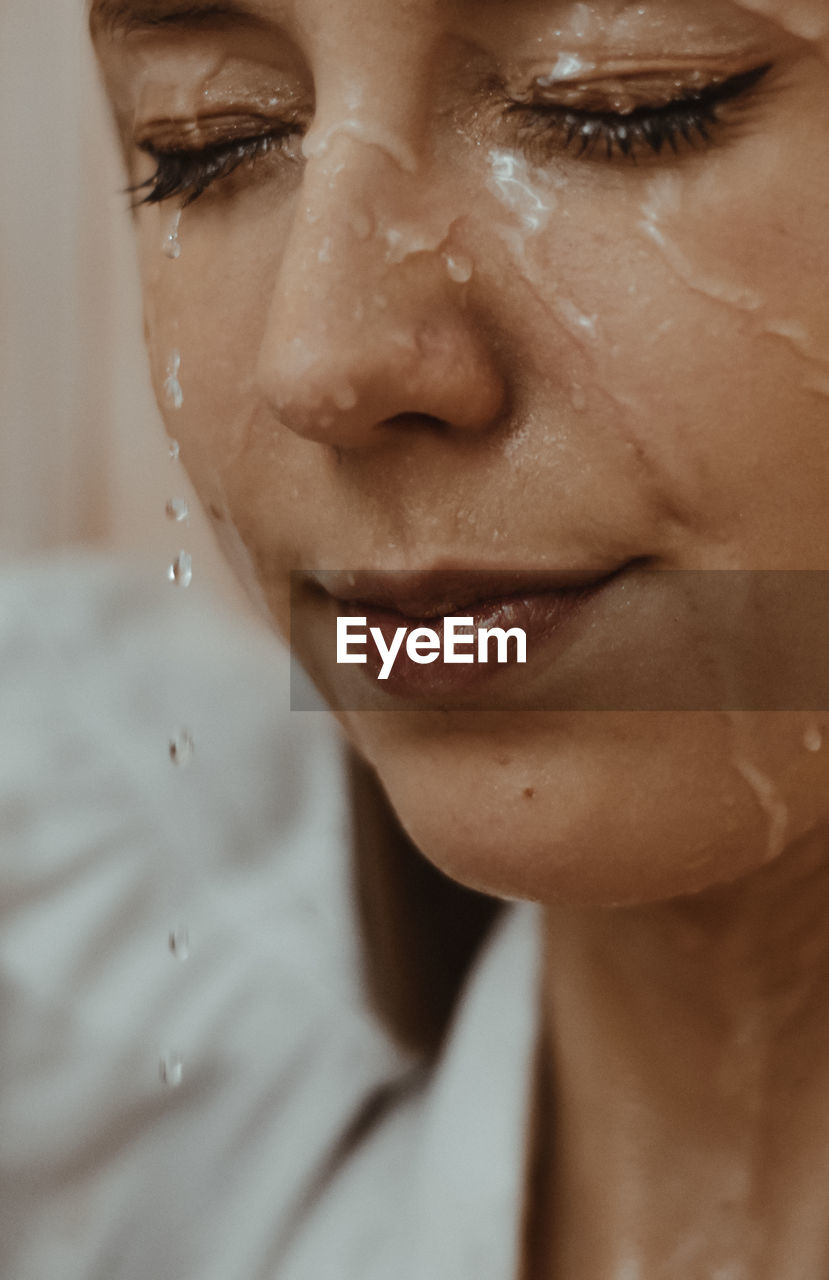 Close-up of water flowing on woman face