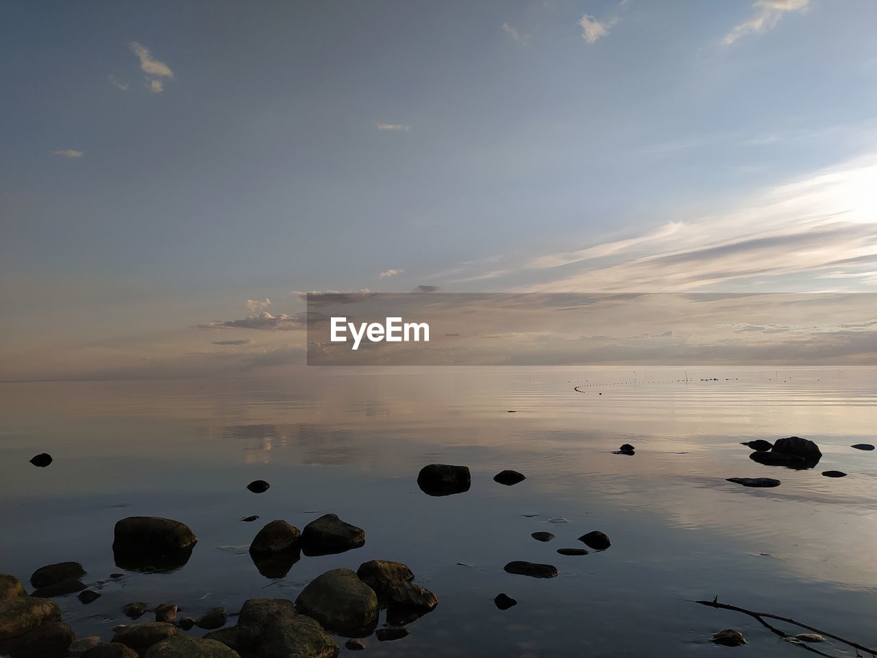 Scenic view of sea against sky at sunset