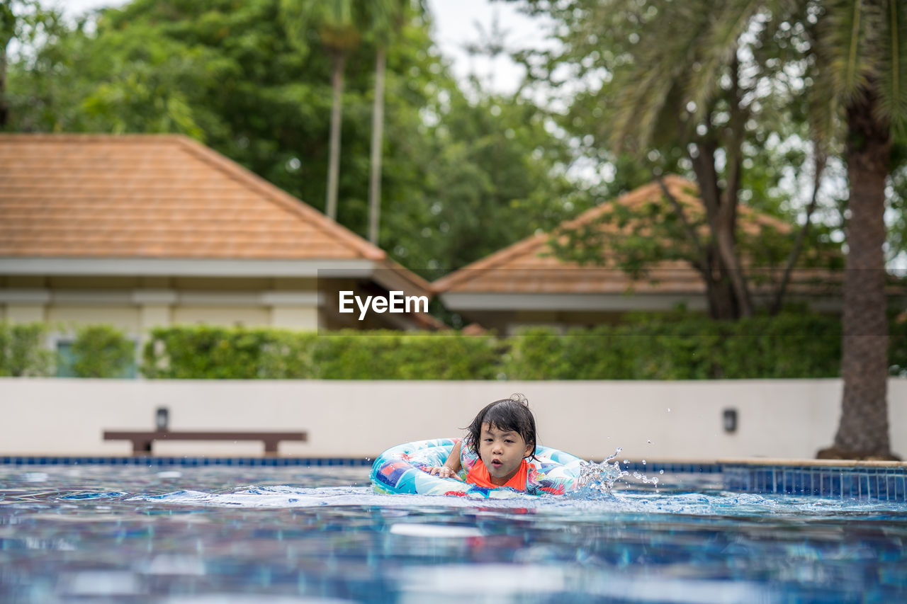 Portrait of boy in swimming pool