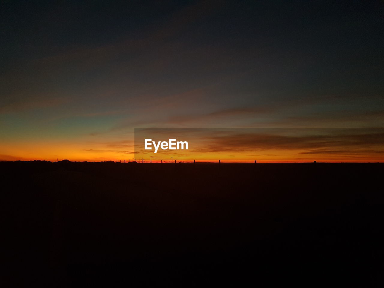 SILHOUETTE LANDSCAPE AGAINST SKY AT SUNSET