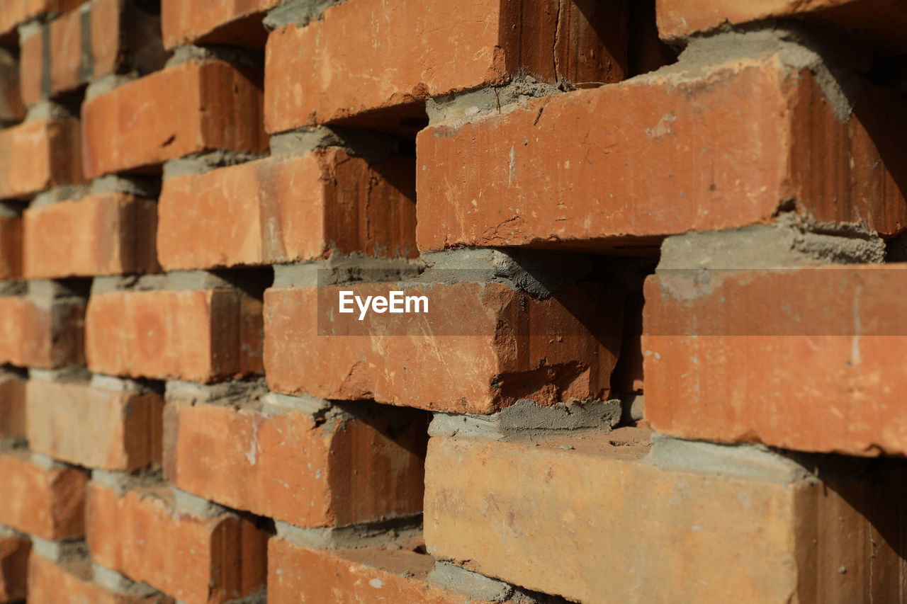 brick, brickwork, wall, backgrounds, full frame, brick wall, architecture, no people, construction material, pattern, industry, brown, large group of objects, close-up, wall - building feature, in a row, wood, built structure, construction industry, red, floor, textured, outdoors, hardwood