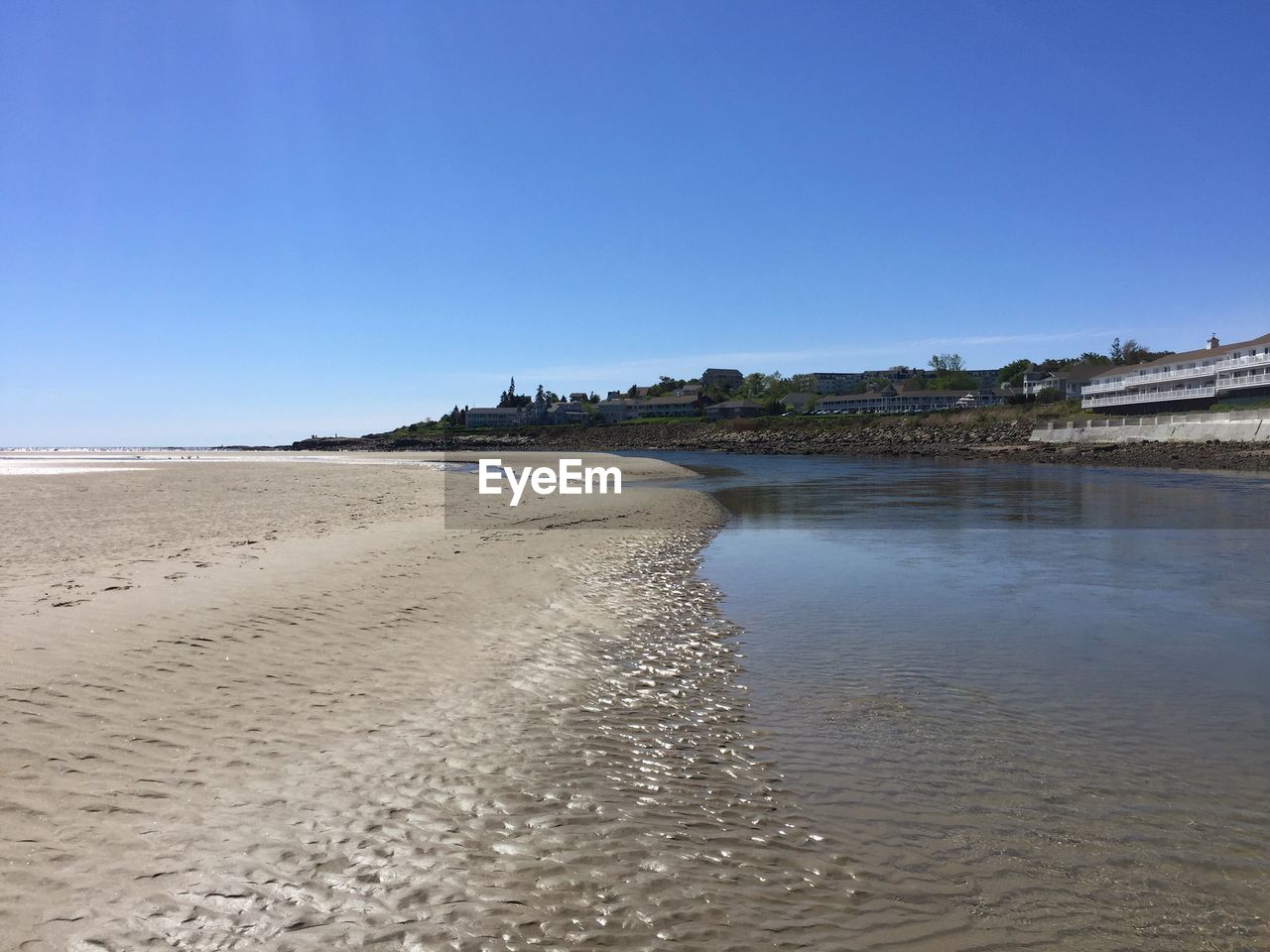 BEACH AGAINST CLEAR BLUE SKY