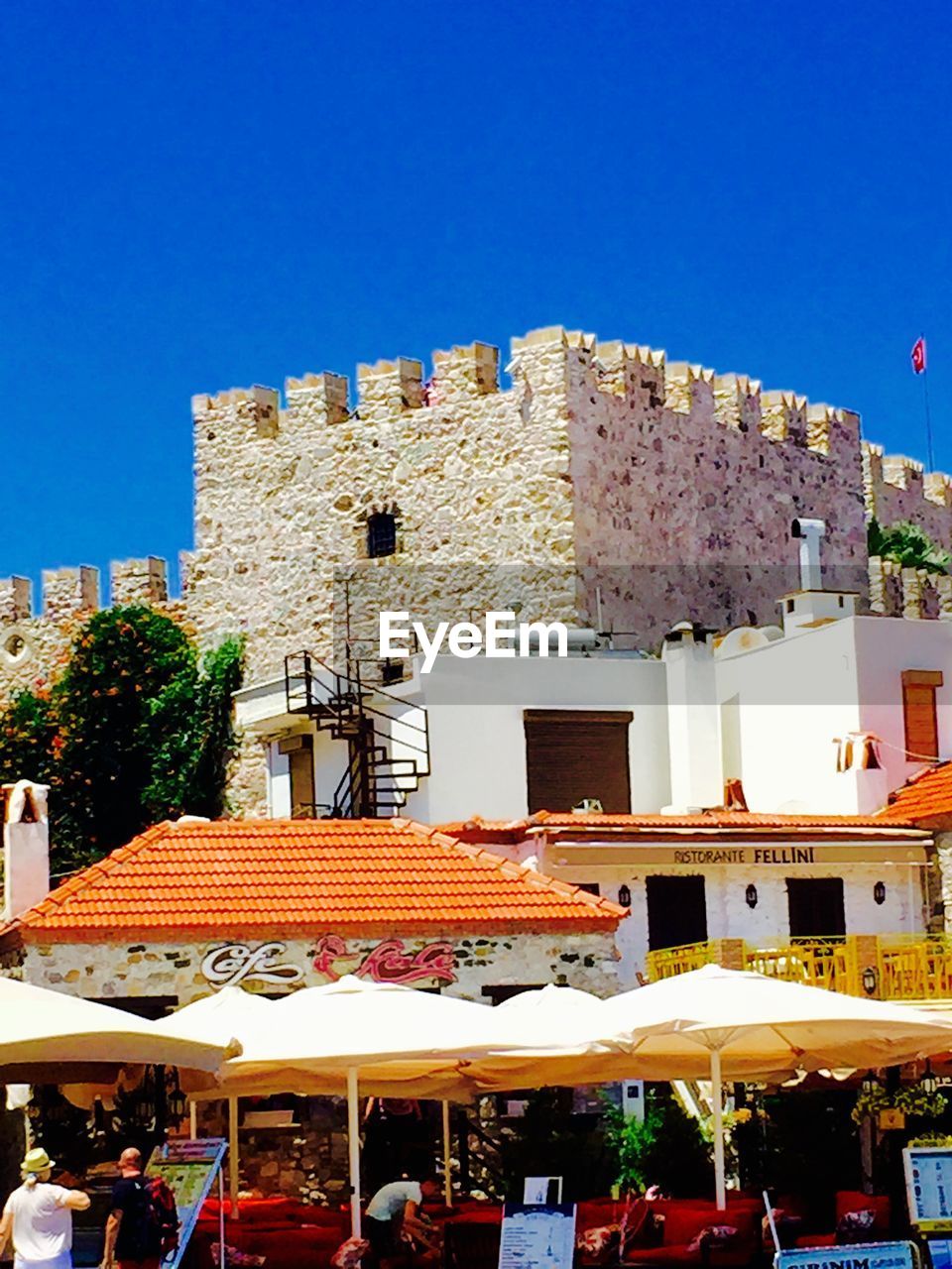 VIEW OF BUILDINGS AGAINST BLUE SKY