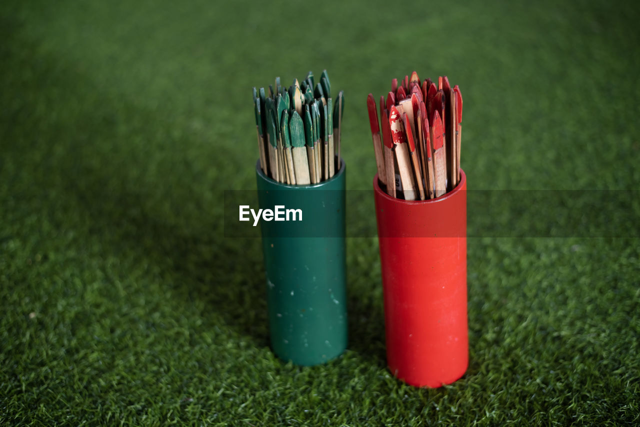 Red and green simsi on green artificial grass,esiimsi is another belief of people. 