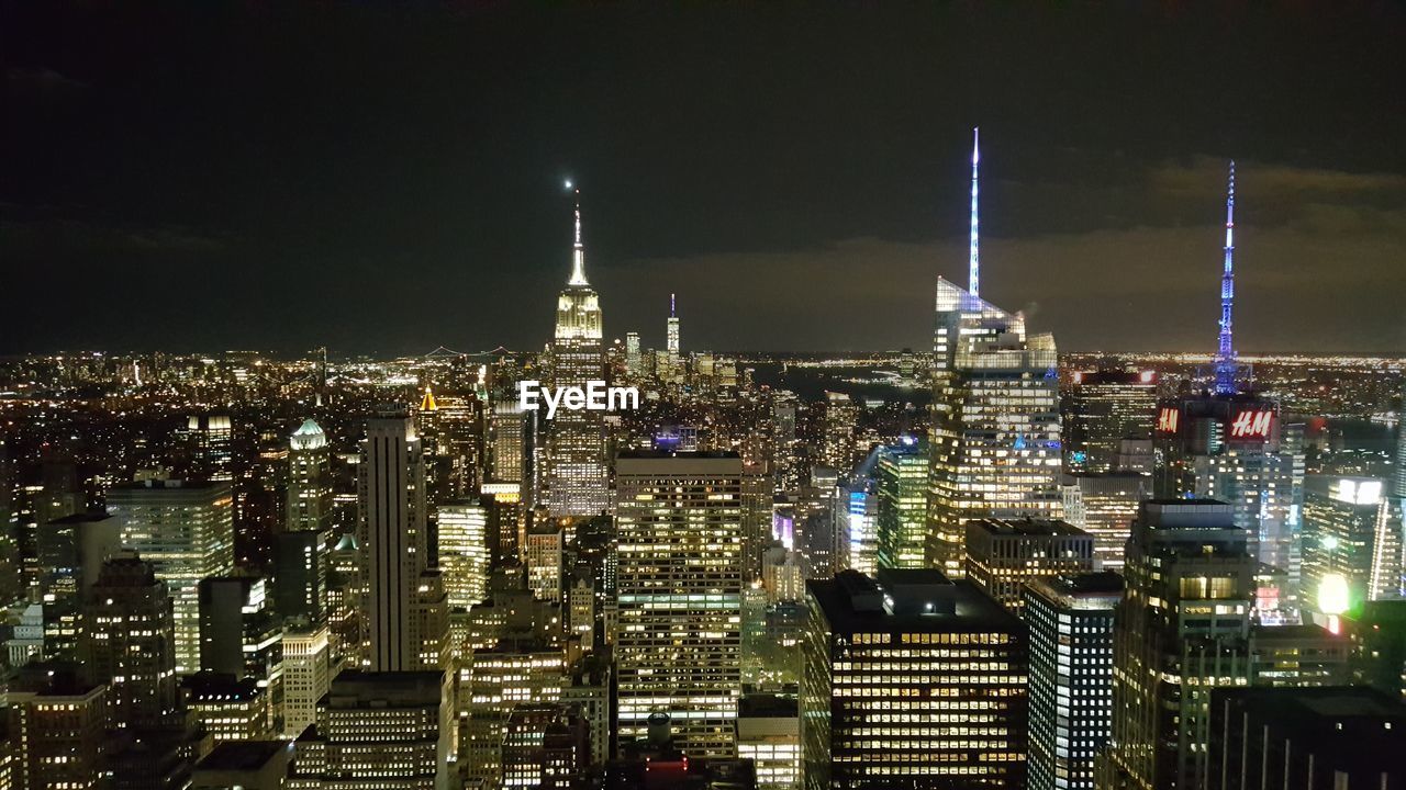 Illuminated buildings in city at night