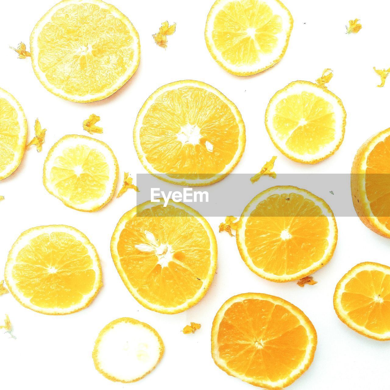 Directly above view of slices of orange against white background