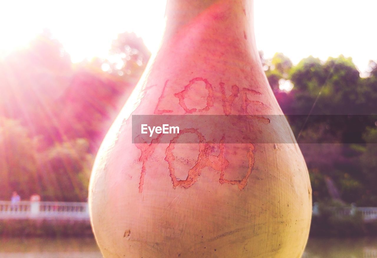 Close-up of i love you written on balustrade