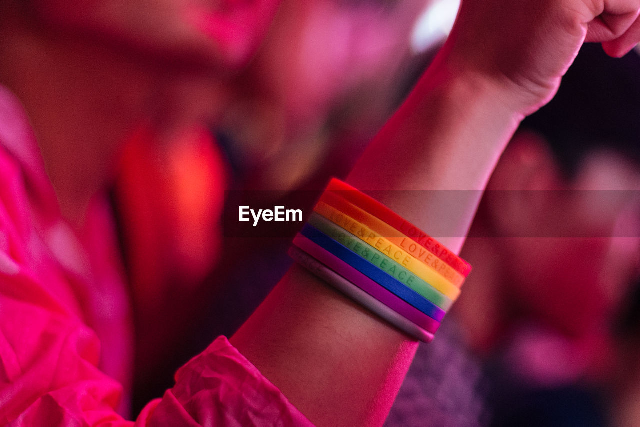 Close-up of woman wearing colorful wristbands