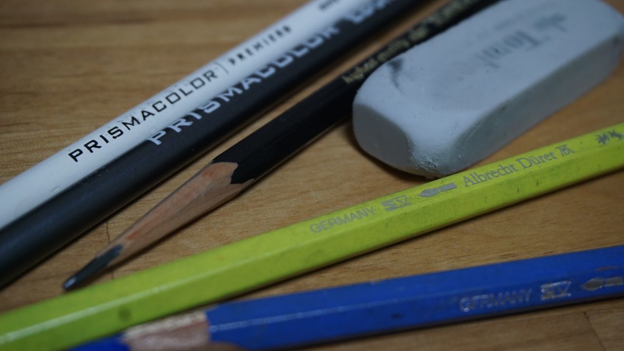 CLOSE-UP OF PENCIL ON TABLE