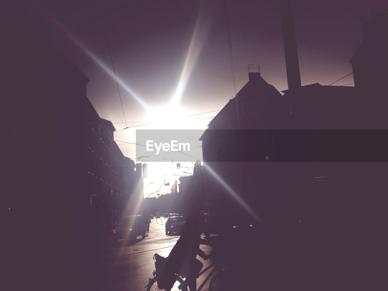 SUN SHINING THROUGH CLOUDS