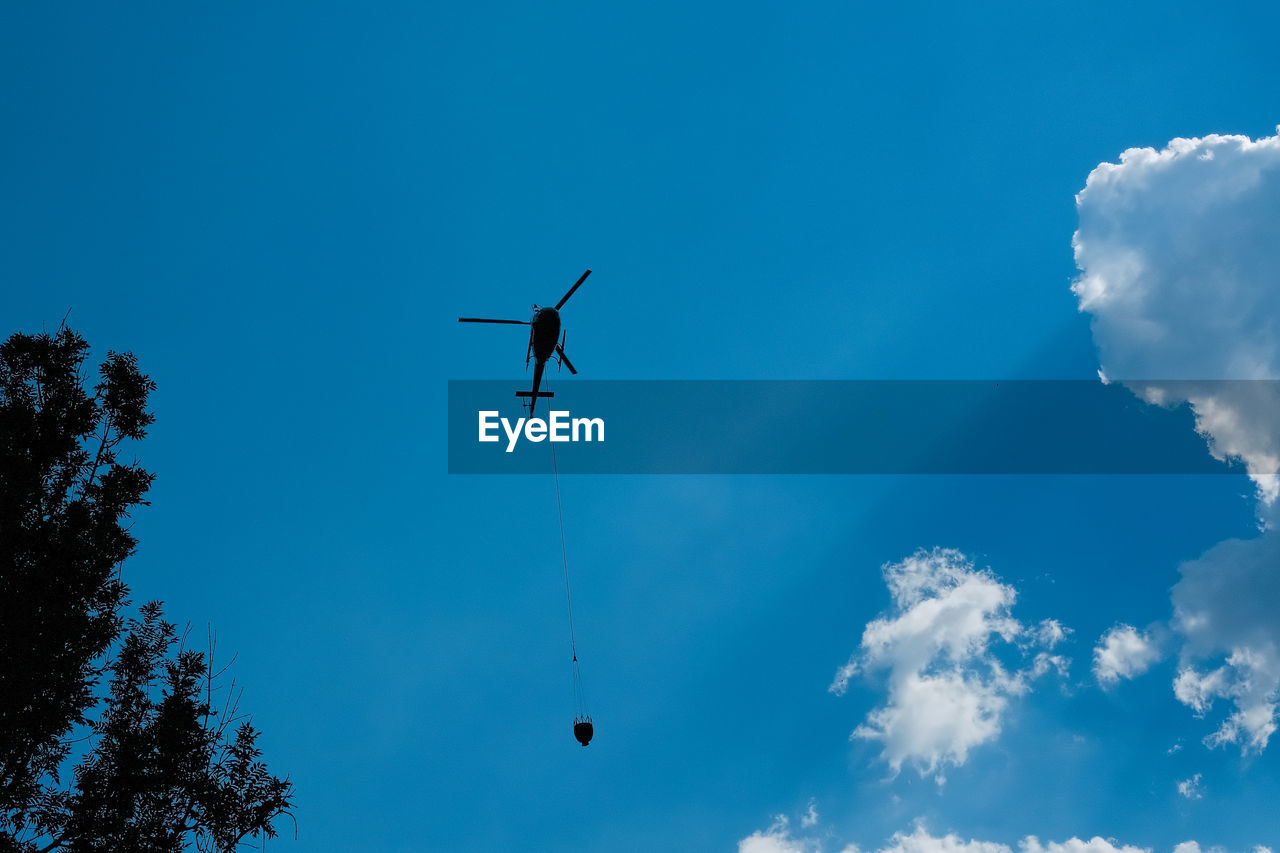 low angle view of airplane flying in sky