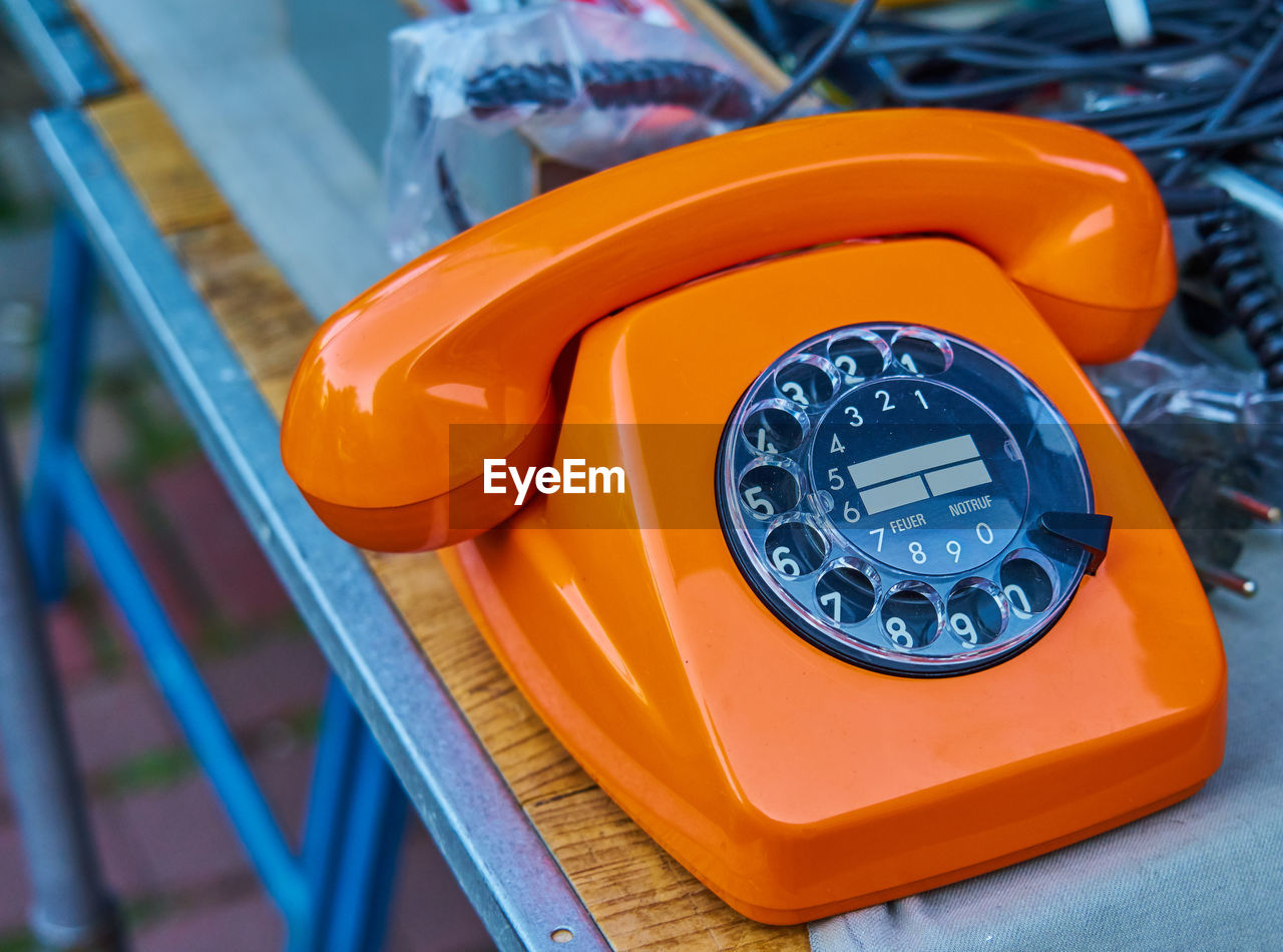 High angle view of telephone booth on table