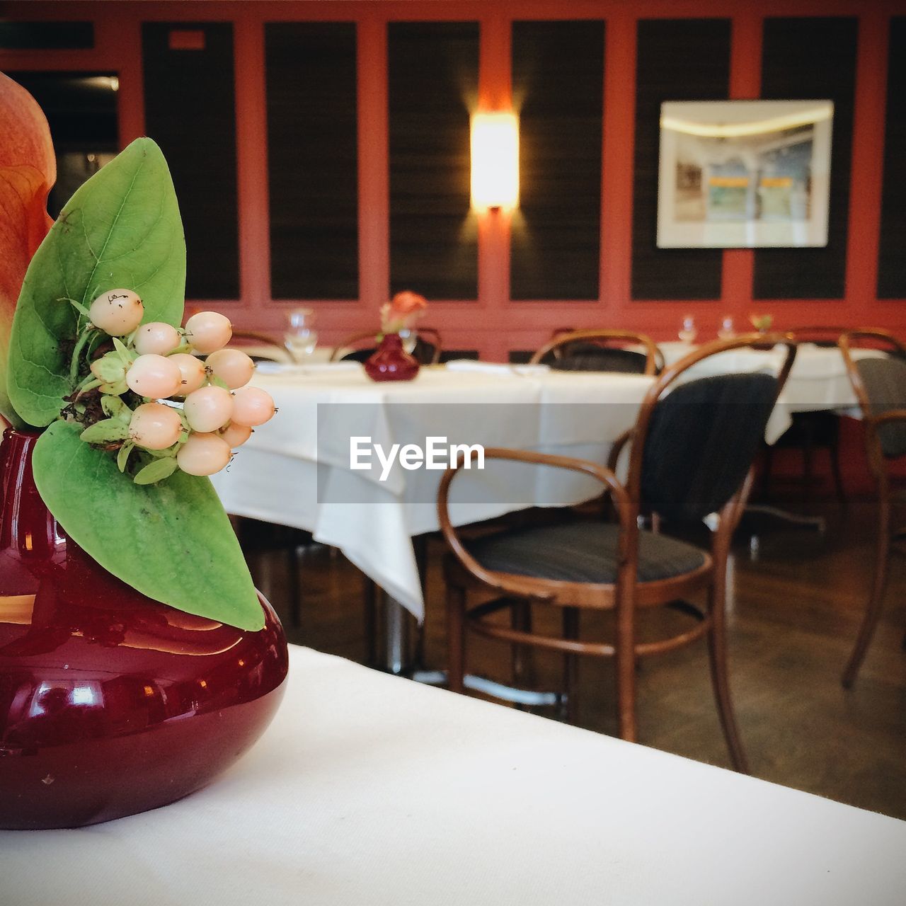 Close-up of artificial flowerpot on table at restaurant