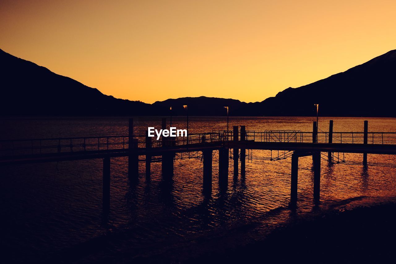 Scenic view of sea against clear sky during sunset