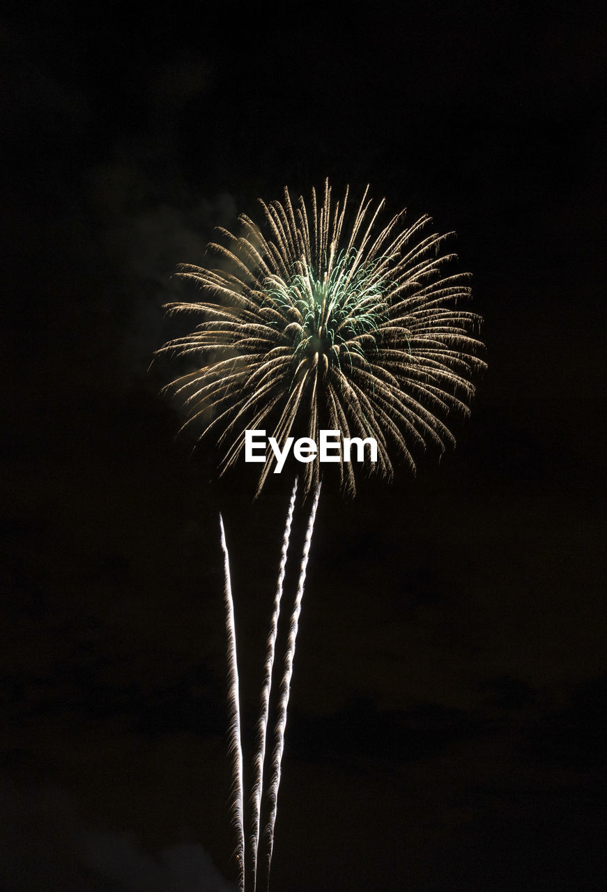 LOW ANGLE VIEW OF FIREWORKS IN SKY