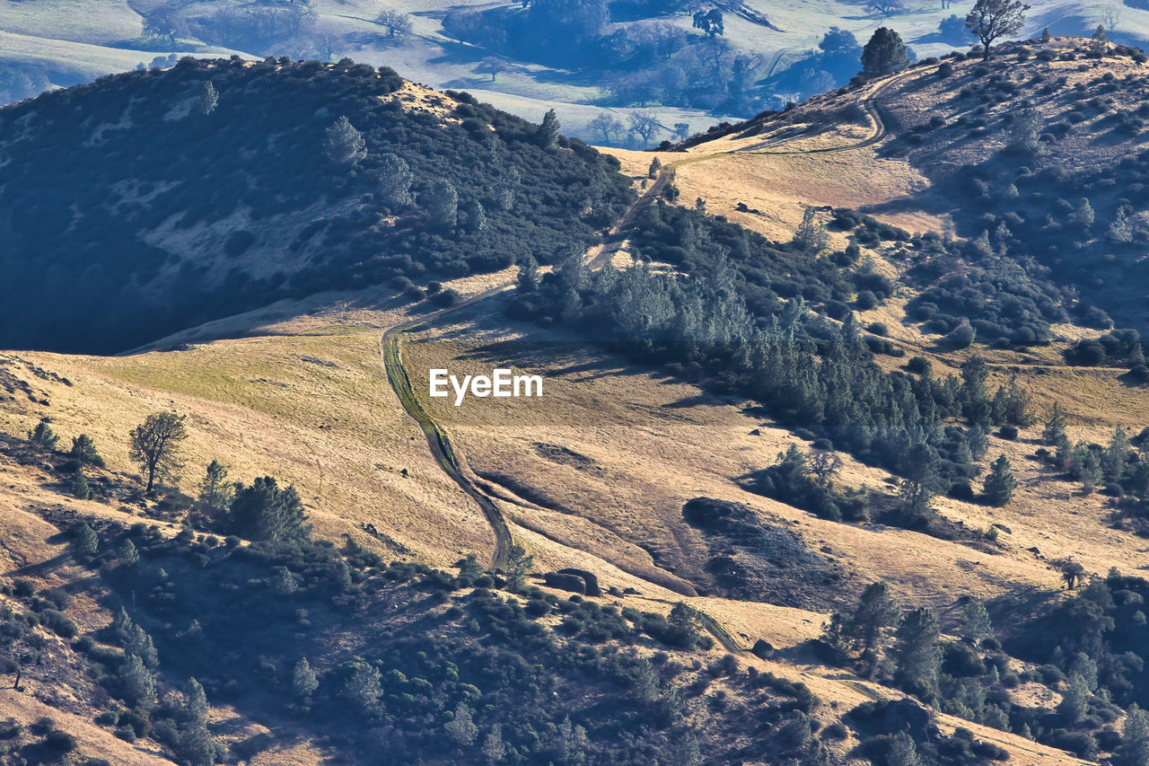 AERIAL VIEW OF LANDSCAPE AND MOUNTAINS