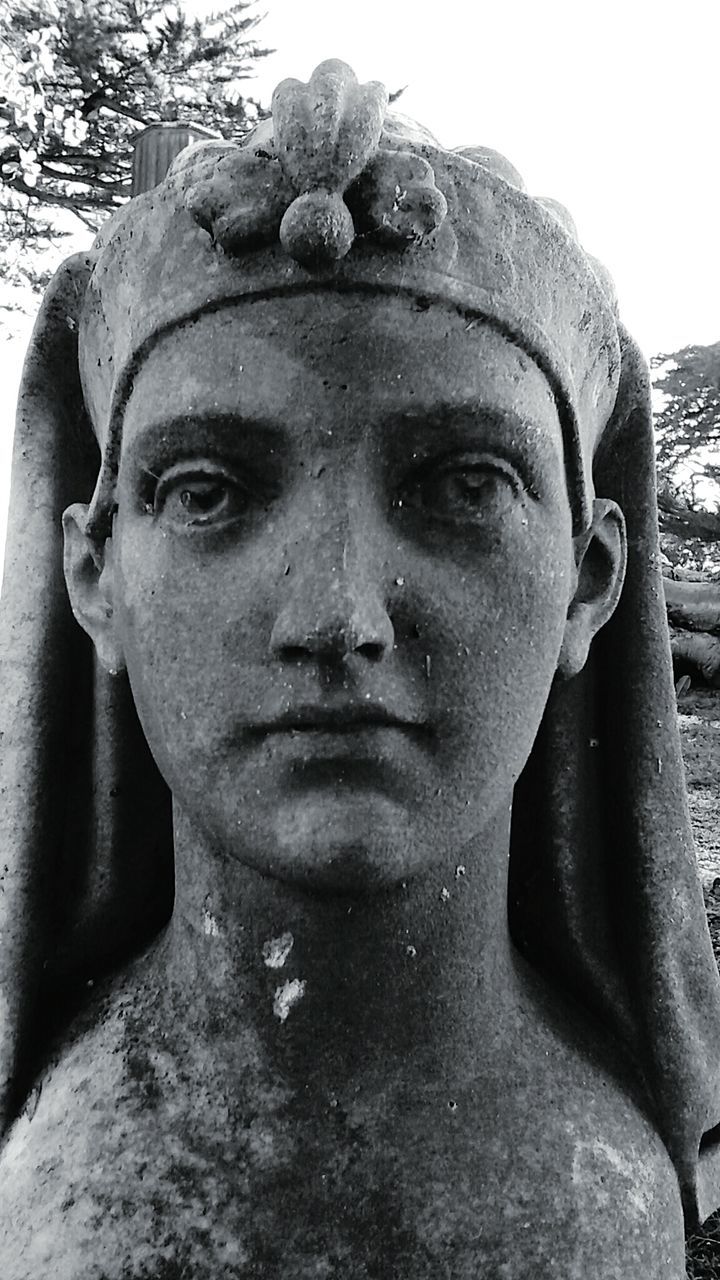 CLOSE-UP OF YOUNG WOMAN