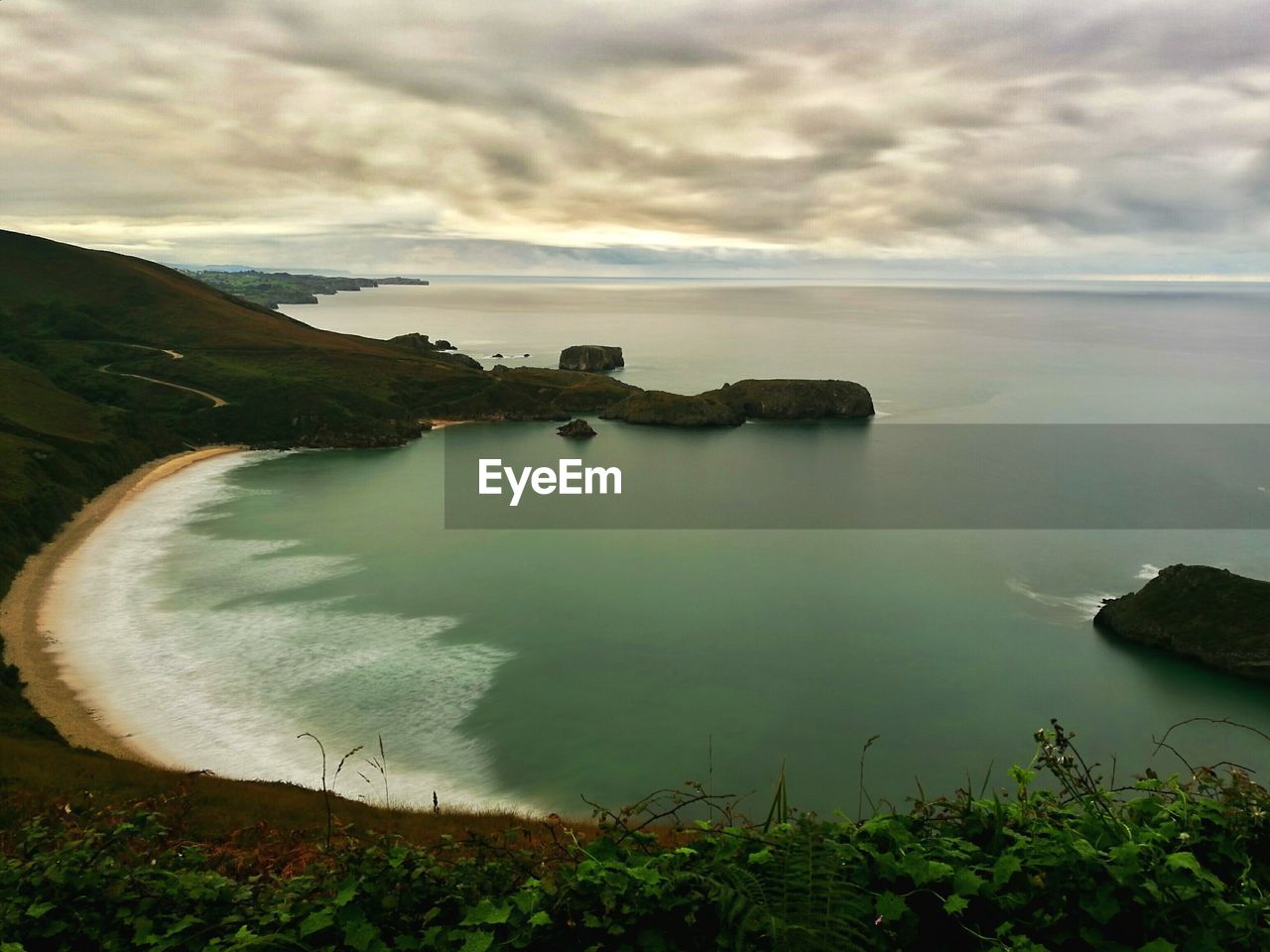 VIEW OF CALM BLUE SEA AGAINST CLOUDY SKY