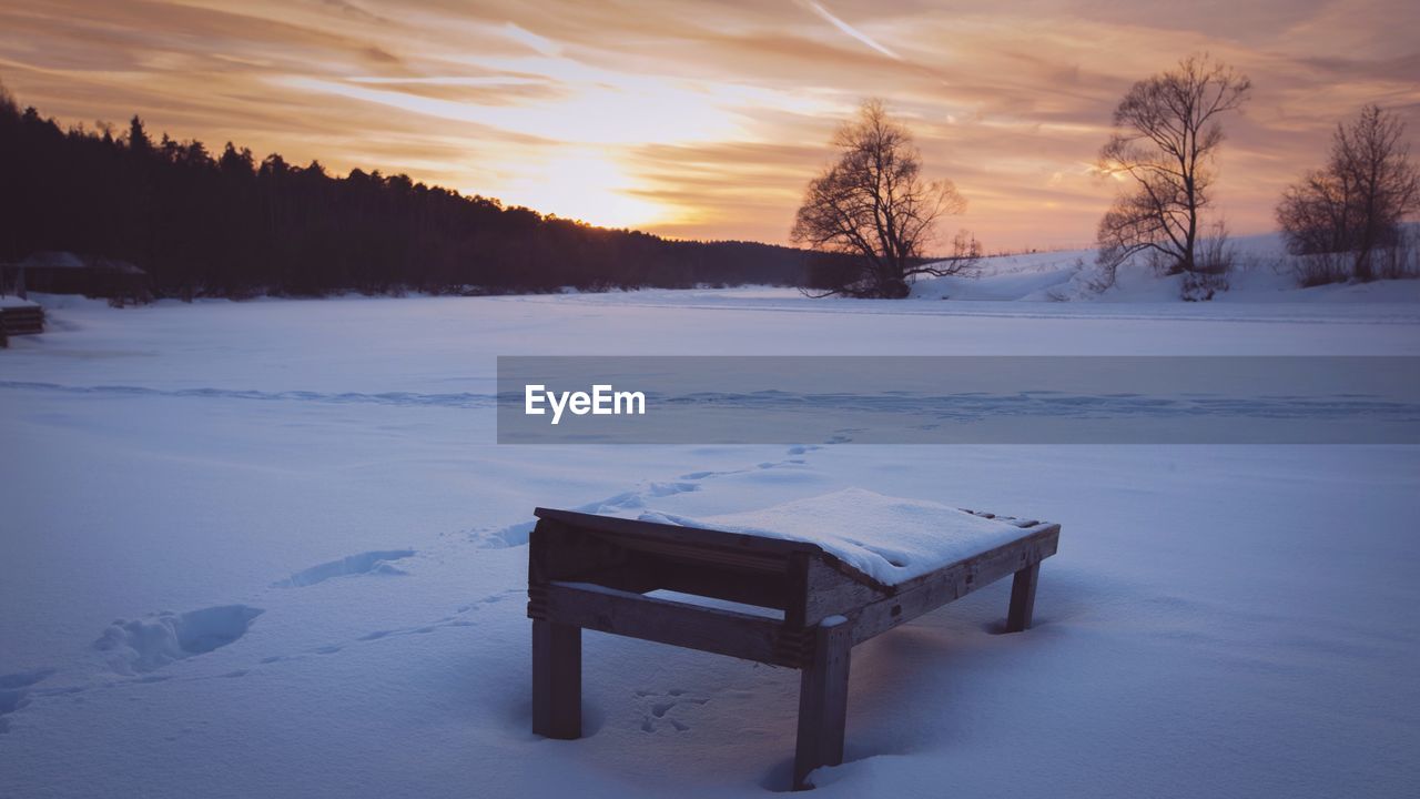 SNOW COVERED LANDSCAPE DURING SUNSET