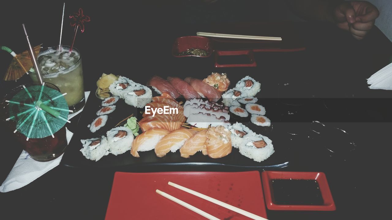 High angle view of seafood and drinks served on table in restaurant