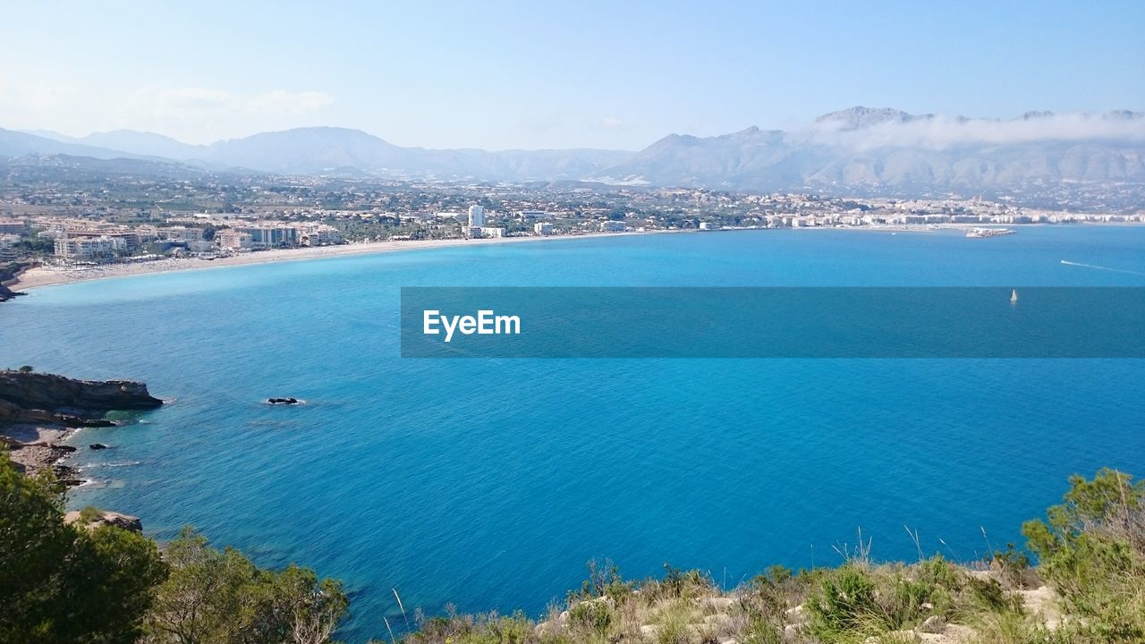 Scenic view of sea against blue sky