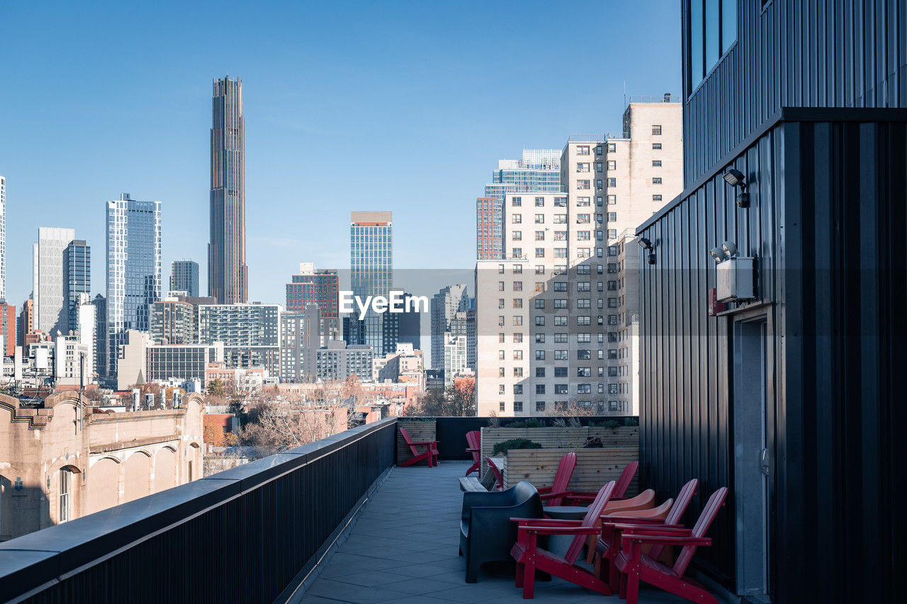 View of modern tall office buildings and apartment buildings seen from roof deck in brooklyn, ny