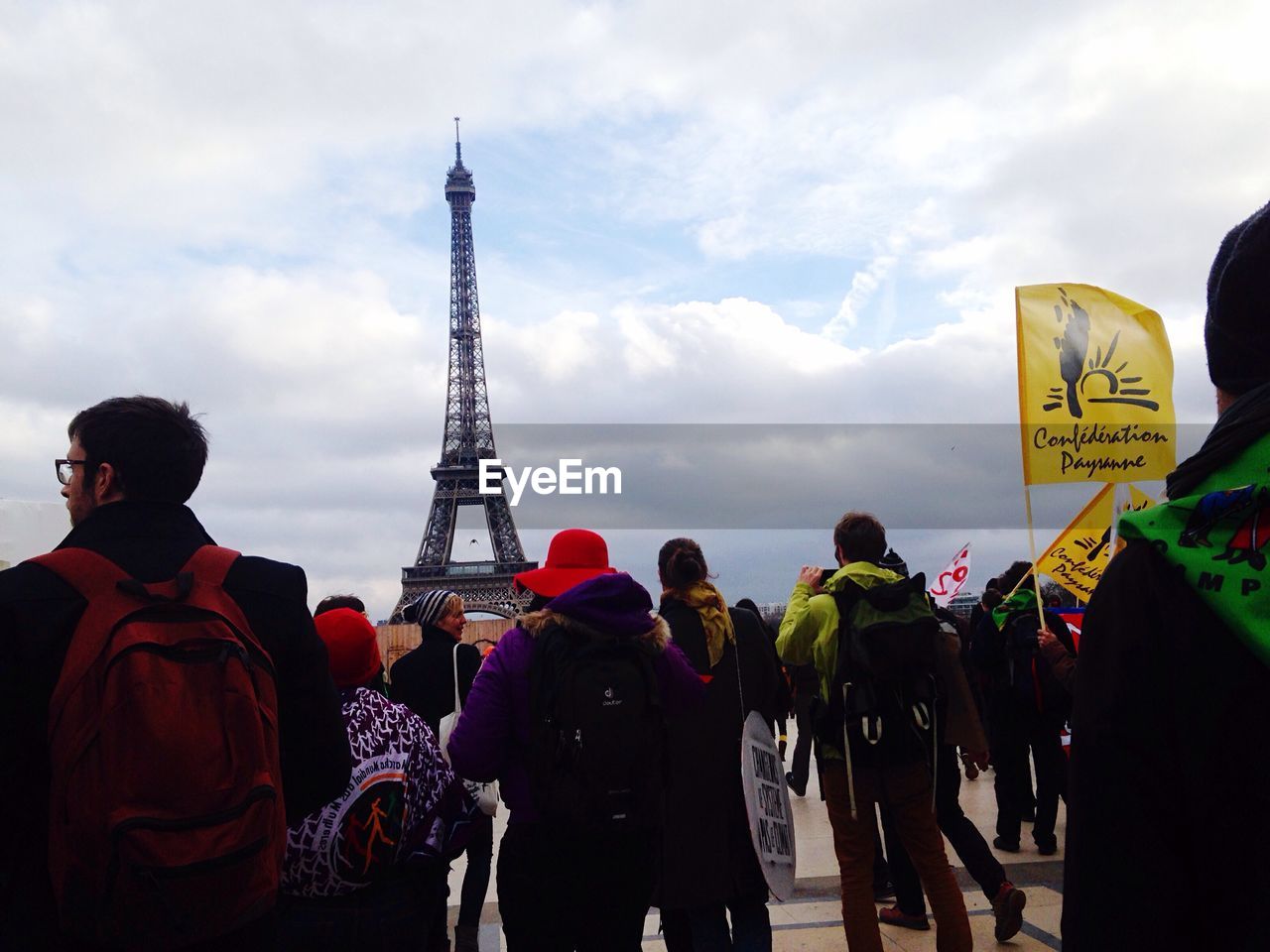 SILHOUETTE OF PEOPLE STANDING ON TOWER