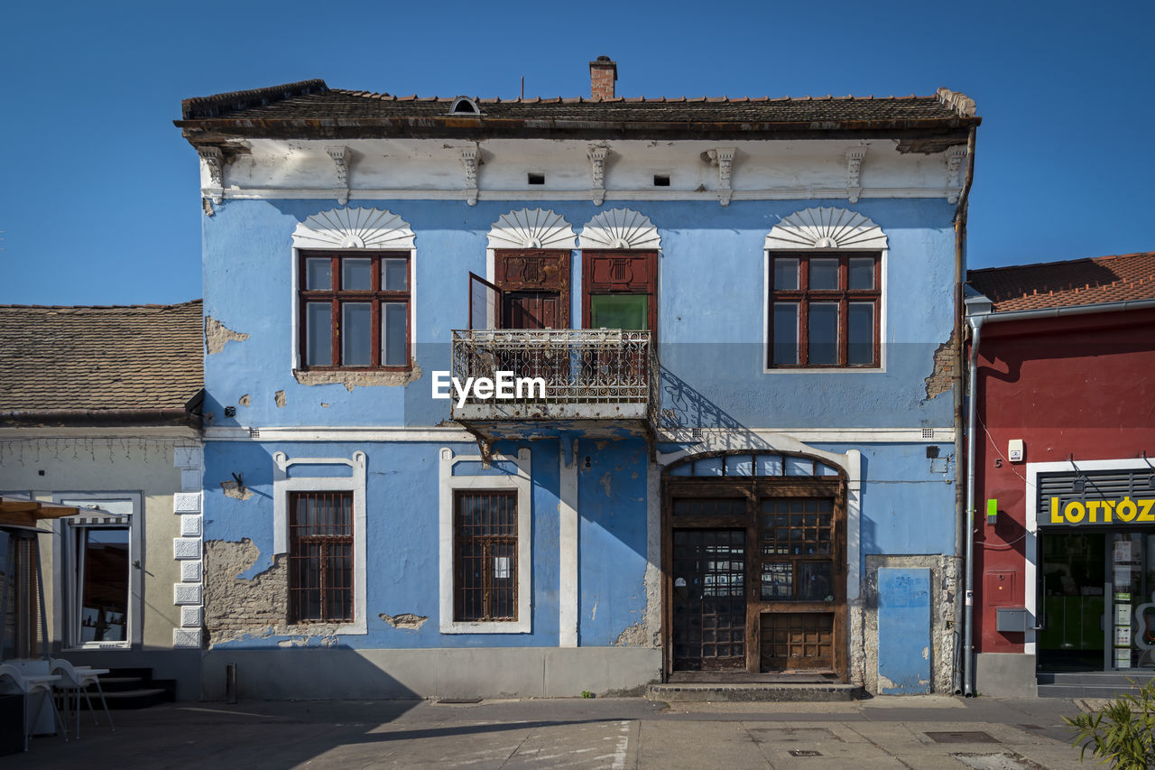 OLD BUILDING AGAINST BLUE SKY