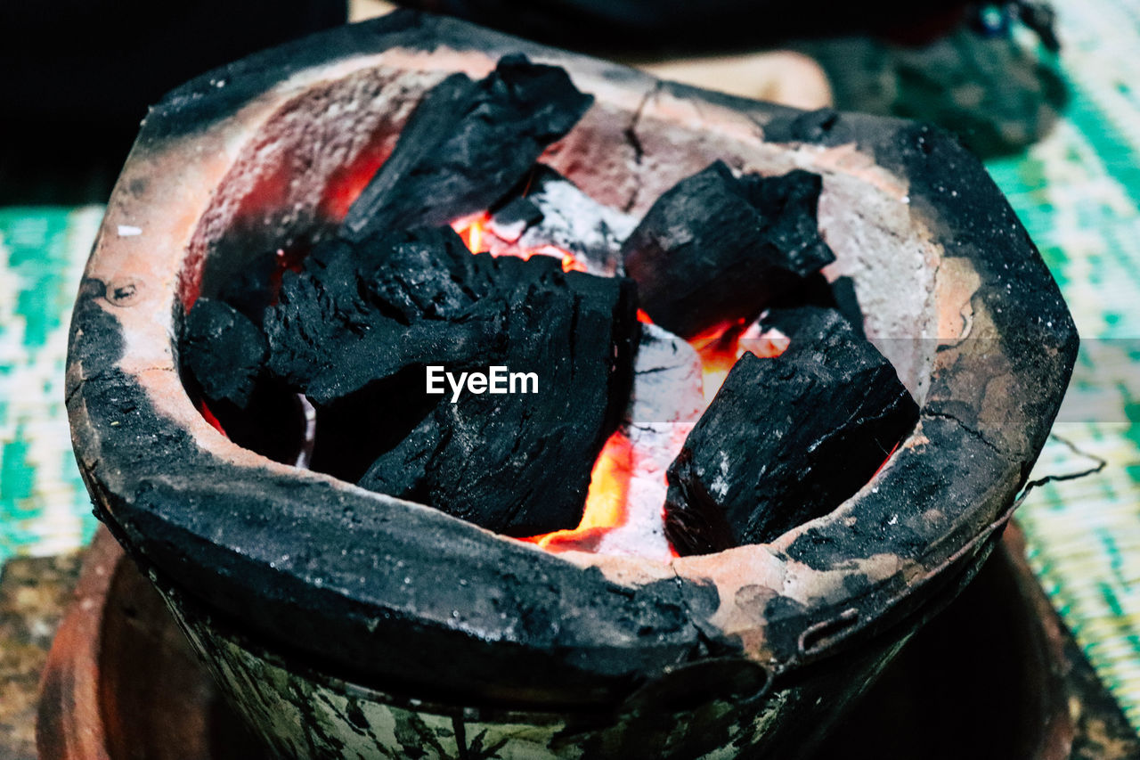 High angle view of fire in charcoal stove