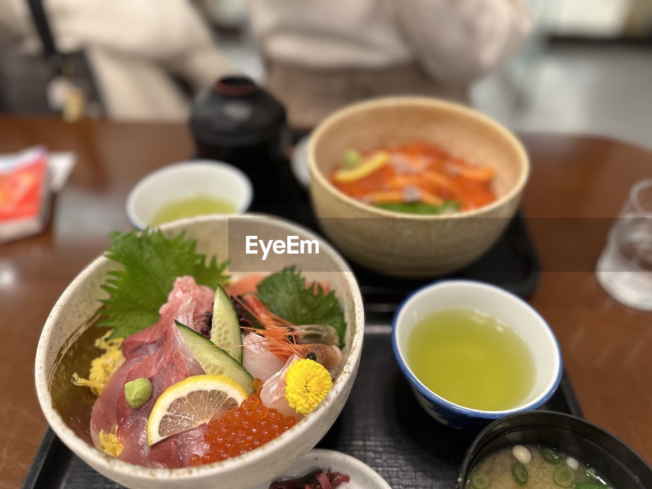food and drink, food, healthy eating, lunch, bowl, asian food, dish, meal, cuisine, wellbeing, chinese food, freshness, vegetable, indoors, no people, table, meat, focus on foreground, plate, fruit, savory food, condiment, seafood, close-up, variation