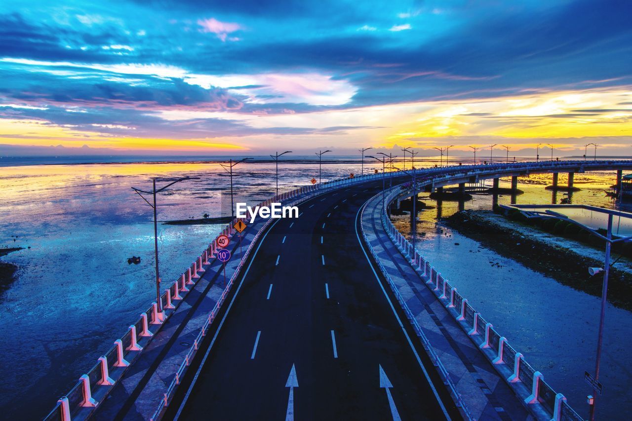 PANORAMIC VIEW OF BRIDGE OVER SEA AGAINST SKY