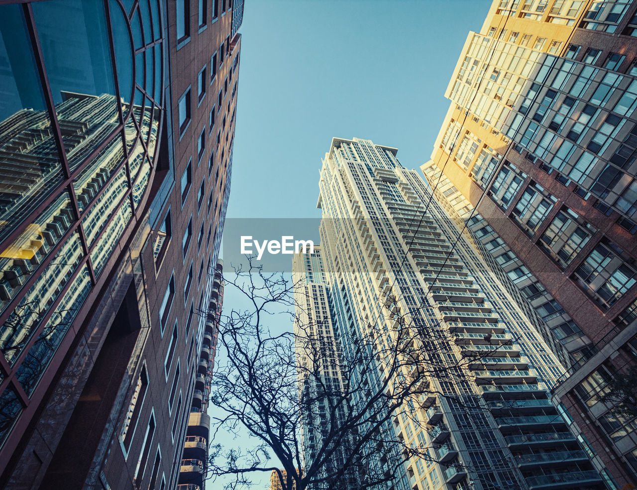 Low angle view of modern buildings against clear sky