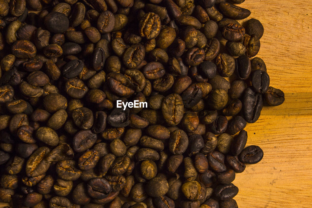 Close-up of roasted coffee beans on cutting board