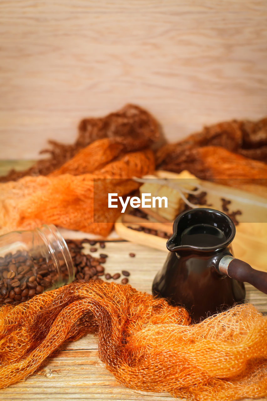 HIGH ANGLE VIEW OF COFFEE ON TABLE IN KITCHEN
