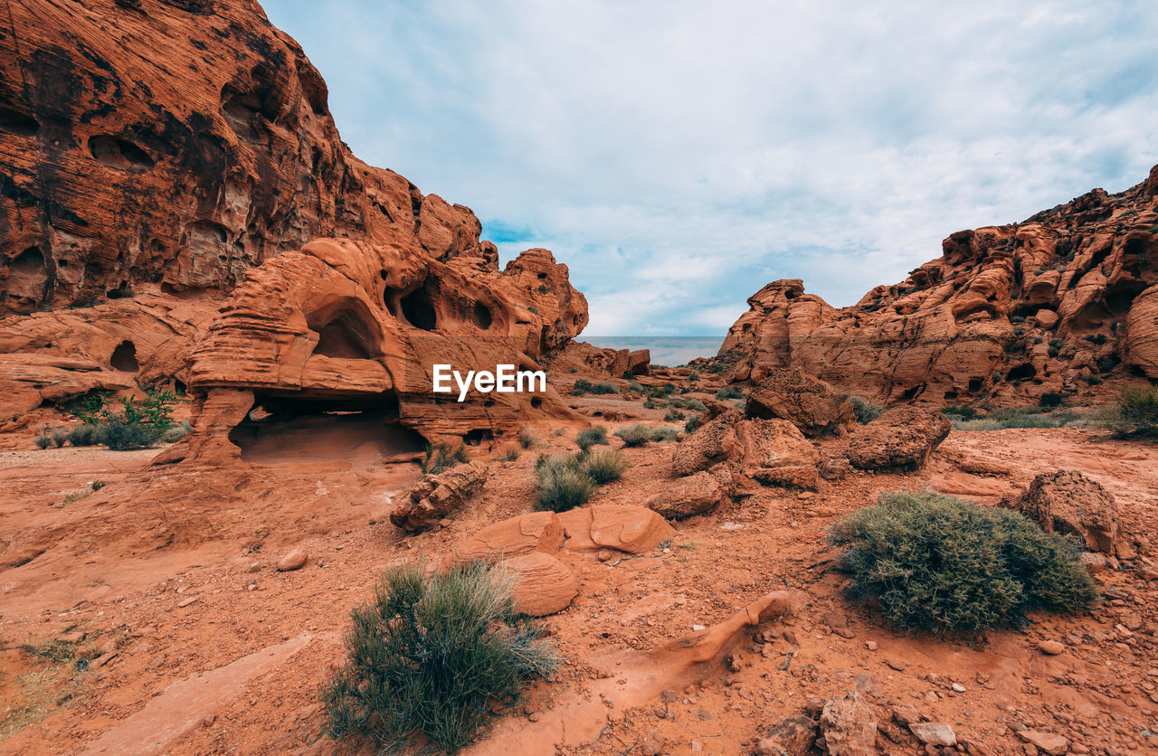 Low angle view of rock formations against sky