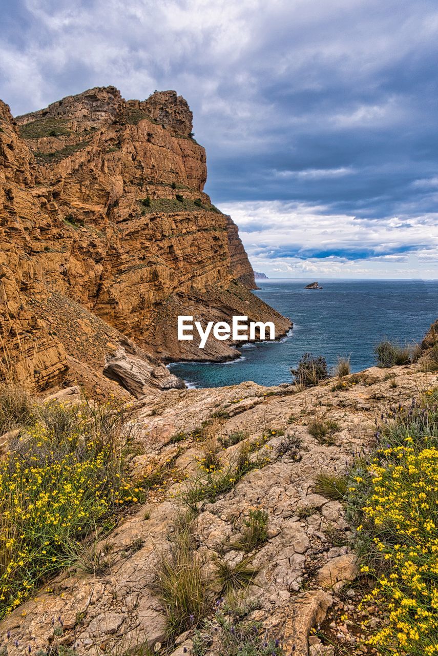 scenic view of sea against cloudy sky