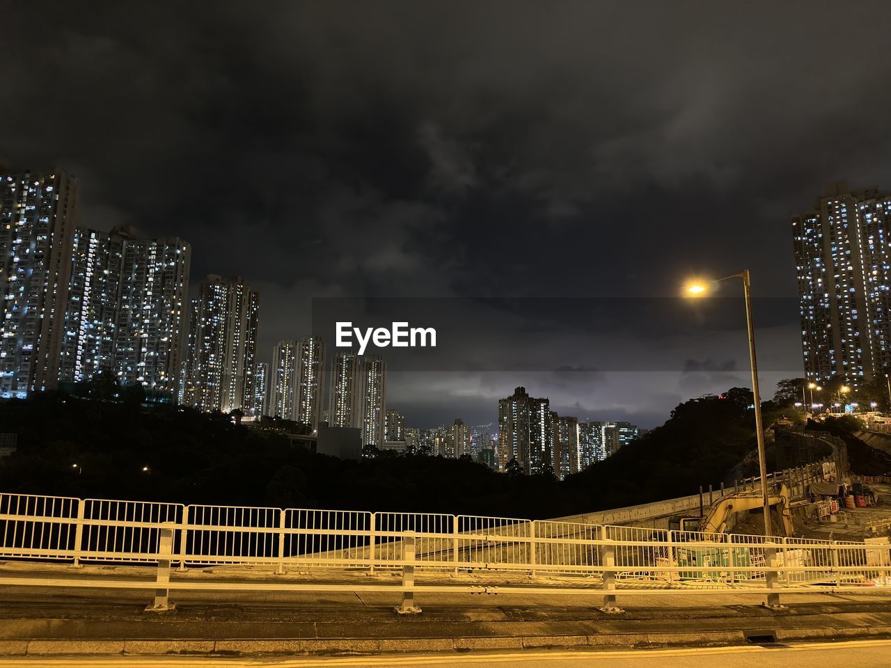 night, sky, evening, illuminated, architecture, cityscape, built structure, light, city, cloud, dusk, darkness, no people, nature, reflection, building exterior, storm, street, skyline, motion, long exposure, outdoors, sports, street light, horizon, building, road, landmark, travel destinations, landscape