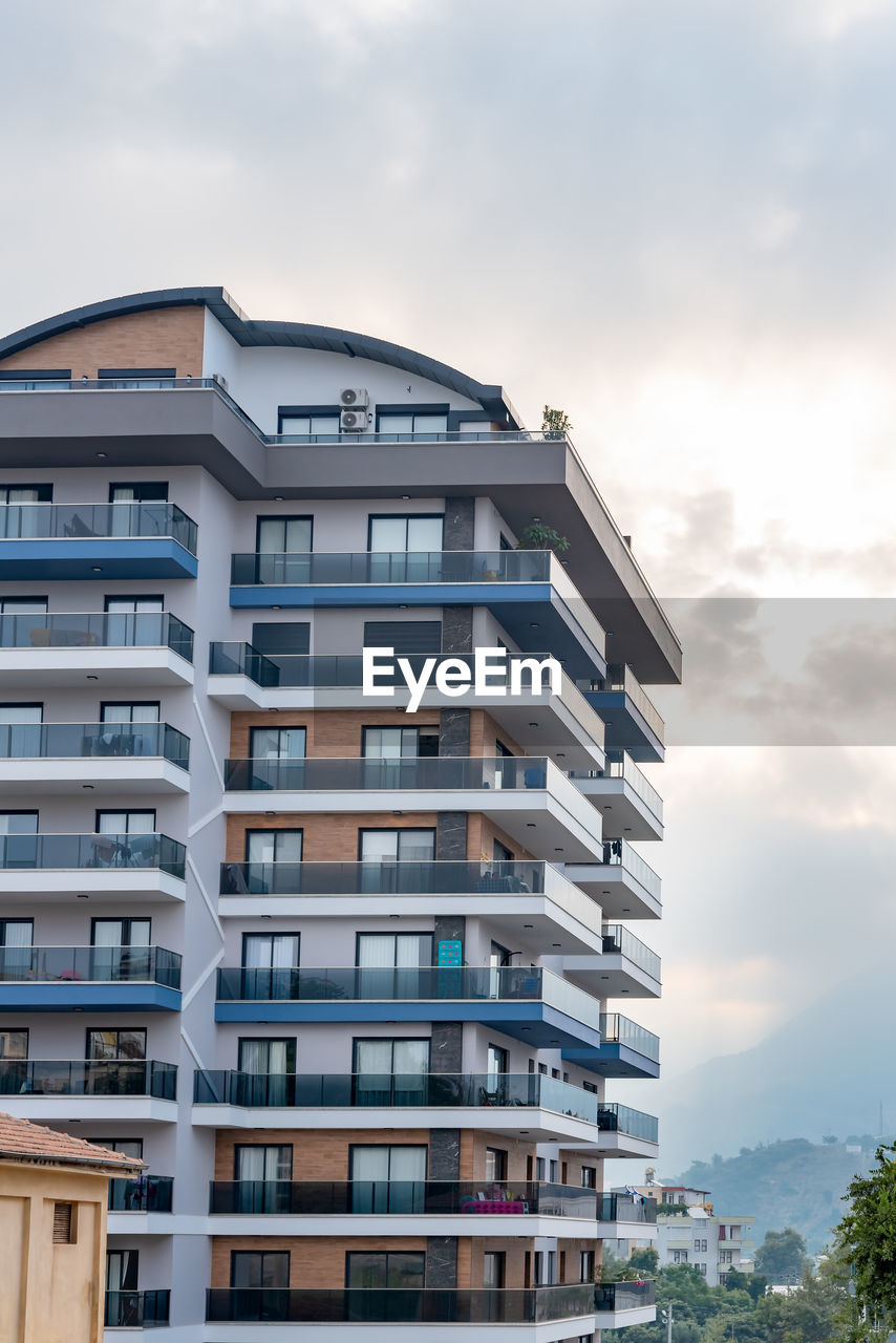 Tall apartment building. fragment of a residential building. architecture of southern turkey.