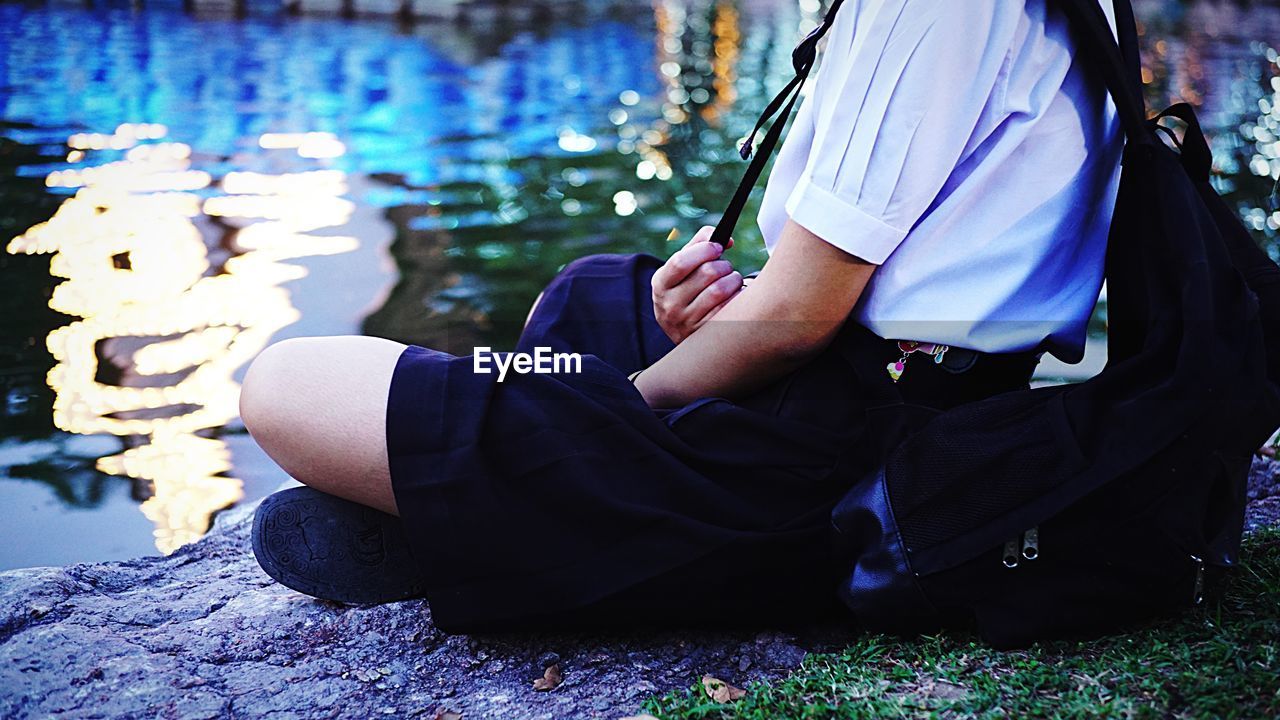 Close-up of schoolgirl sitting outdoors